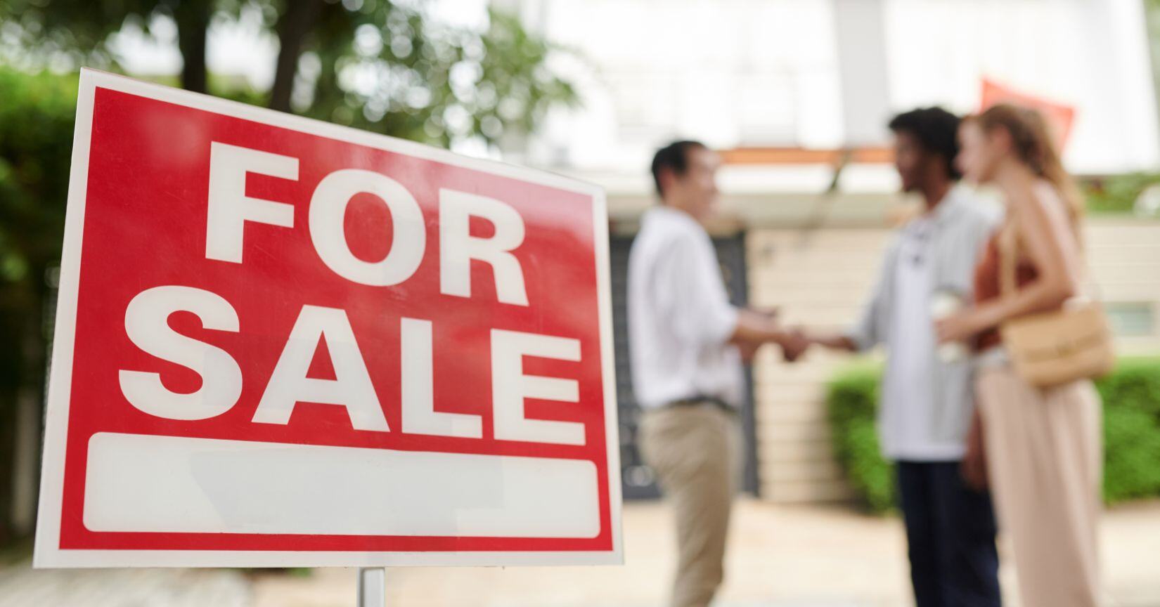 For sale sign in the yard of a property listed on the MLS