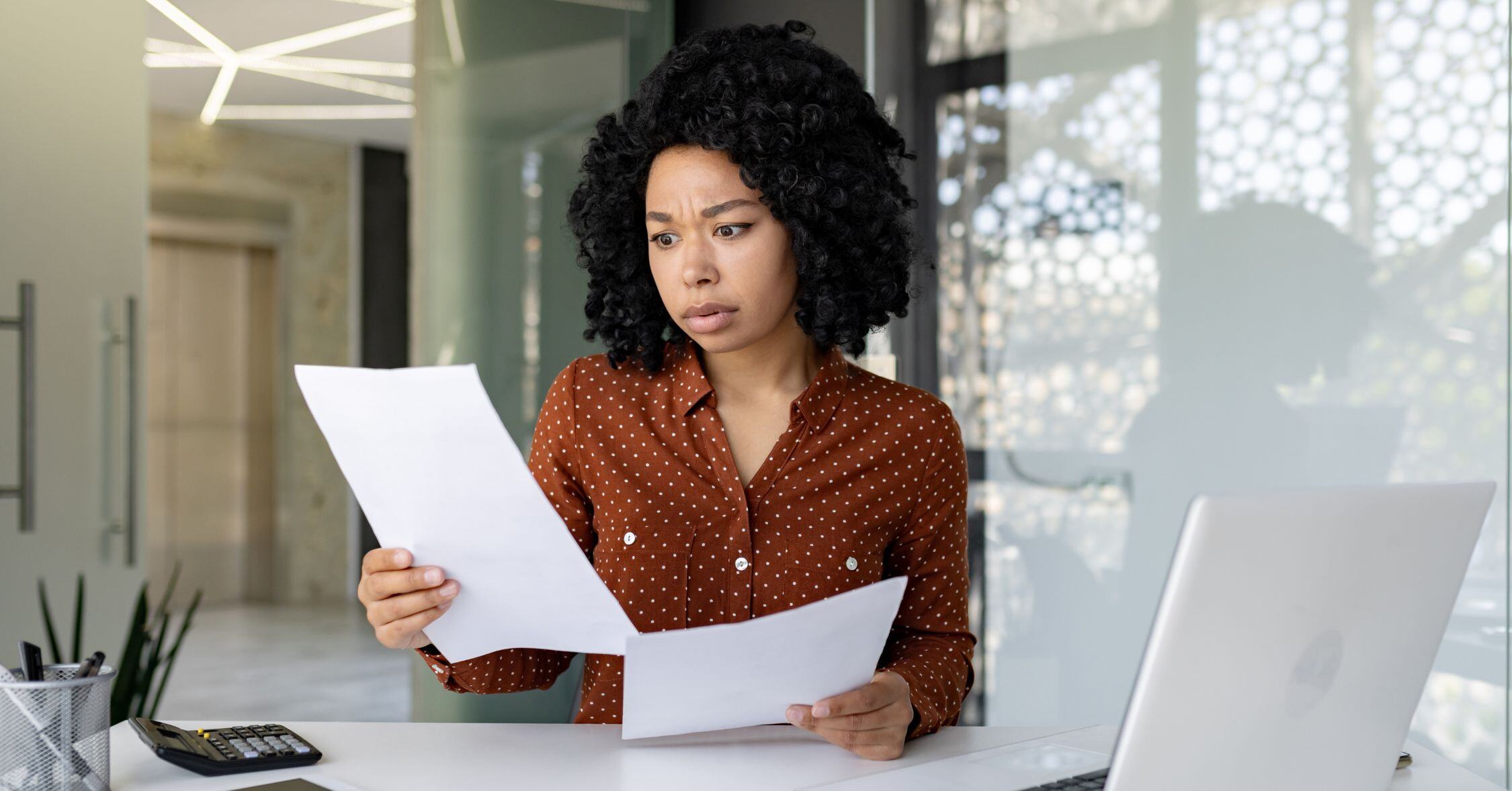 Woman looking through public records to find llc owner