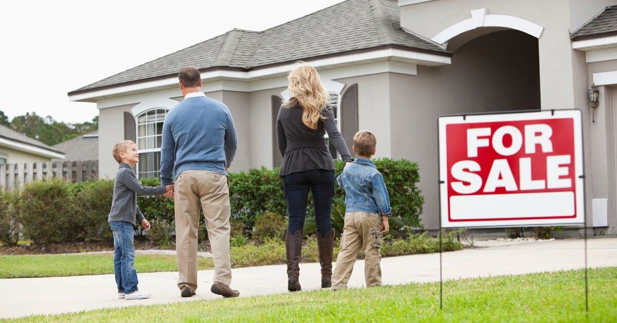 Family looking at sold house